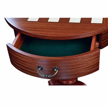 Cajón abierto forrado con fieltro verde bajo el tablero de caoba