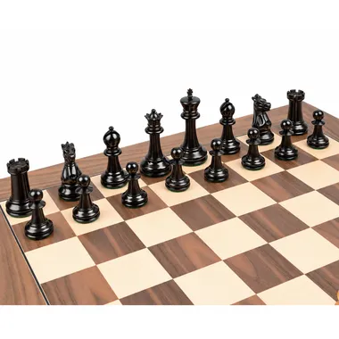 Piezas negras de ébano del juego Staunton 1869 alineadas sobre el tablero de nogal